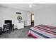 Carpeted bedroom with ceiling fan, desk, and closet visible in doorway at 4148 Shasta Cir, Clover, SC 29710