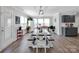 Bright dining area with a large table, ample seating, and natural light from multiple windows at 4148 Shasta Cir, Clover, SC 29710