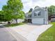 A two-story house with front yard and long driveway leading to the garage at 4148 Shasta Cir, Clover, SC 29710