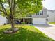 Two-story house with a manicured lawn, trees, landscaping and attached two car garage at 4148 Shasta Cir, Clover, SC 29710