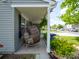Relaxing front porch with wicker swing, front yard and plants at 4148 Shasta Cir, Clover, SC 29710