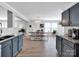 Open concept kitchen with dark gray cabinets and an eat-in dining area at 4148 Shasta Cir, Clover, SC 29710