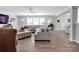 Large living room with neutral colored furniture, wood flooring, and an open concept to the kitchen at 4148 Shasta Cir, Clover, SC 29710