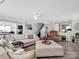Spacious living room featuring a large sectional sofa, wood floors, and neutral decor at 4148 Shasta Cir, Clover, SC 29710
