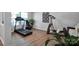 Well-lit workout area with modern exercise equipment and stylish wood flooring at 4148 Shasta Cir, Clover, SC 29710