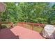 Expansive back deck overlooking lush greenery and a serene backyard at 4232 Shannamara Dr, Matthews, NC 28104
