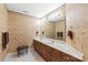 Charming bathroom with double sink vanity, decorative wallpaper and stool at 4232 Shannamara Dr, Matthews, NC 28104