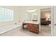 Bathroom with bathtub, vanity, and a view into the main bedroom at 4232 Shannamara Dr, Matthews, NC 28104