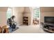 Spacious bedroom featuring exercise equipment, bright windows, and carpeting at 4232 Shannamara Dr, Matthews, NC 28104