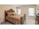 Bedroom with neutral walls, carpet, and a dark wood bed frame at 4232 Shannamara Dr, Matthews, NC 28104