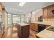Spacious kitchen with island, breakfast nook, wood floors, and modern appliances at 4232 Shannamara Dr, Matthews, NC 28104