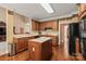 Functional kitchen with wooden cabinets, central island, and modern appliances at 4232 Shannamara Dr, Matthews, NC 28104