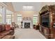 Bright and airy living room with fireplace, carpet, and comfortable seating at 4232 Shannamara Dr, Matthews, NC 28104