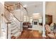 Inviting living room with a fireplace, staircase, and ample natural light at 4232 Shannamara Dr # 85, Matthews, NC 28104
