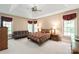 Spacious main bedroom with a ceiling fan, carpet, and large windows at 4232 Shannamara Dr, Matthews, NC 28104