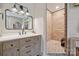A stylish bathroom featuring a vanity with a modern mirror, and a tiled walk-in shower at 425 W North Corner Rd, Lancaster, SC 29720