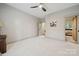 A simple bedroom featuring neutral paint, ceiling fan, and neutral carpet at 425 W North Corner Rd, Lancaster, SC 29720