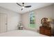 A bright bedroom features a large window, neutral paint and a ceiling fan at 425 W North Corner Rd, Lancaster, SC 29720