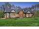 Stunning craftsman-style home with manicured lawn, stone accents, and a welcoming entryway at 425 W North Corner Rd, Lancaster, SC 29720