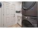 A tidy laundry room features a washer and dryer, and granite countertops at 425 W North Corner Rd, Lancaster, SC 29720