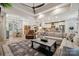Open living space featuring a kitchen, dining area, and living room with wood floors at 425 W North Corner Rd, Lancaster, SC 29720
