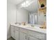 Bathroom featuring double sinks, ample counter space, and a large mirror at 4321 Hornyak Dr, Monroe, NC 28110