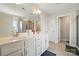 Bright bathroom featuring double sinks, a large mirror, and a glass-enclosed shower at 4321 Hornyak Dr, Monroe, NC 28110
