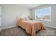 Bedroom with cozy carpet and a soft peach comforter at 4321 Hornyak Dr, Monroe, NC 28110