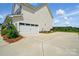 Exterior of home featuring a two-car garage and ample parking space at 4321 Hornyak Dr, Monroe, NC 28110
