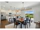 Bright eat-in kitchen features white cabinets, stainless appliances, and a sliding door to the outdoor space at 4321 Hornyak Dr, Monroe, NC 28110