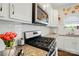 This kitchen features granite countertops, stainless steel appliances, and white cabinets at 4321 Hornyak Dr, Monroe, NC 28110