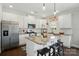 This kitchen features white cabinets, granite countertops, stainless steel appliances, and a breakfast bar at 4321 Hornyak Dr, Monroe, NC 28110