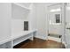 Mudroom with built-in bench and shelves, next to a bathroom at 4321 Hornyak Dr, Monroe, NC 28110