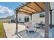 Inviting patio area with pergola, comfortable seating, and outdoor charm at 4321 Hornyak Dr, Monroe, NC 28110