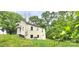 Exterior shot of a home featuring an expansive lawn and mature trees at 440 27Th Street Sw Pl, Hickory, NC 28602