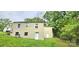 The back exterior features easy access with an outdoor entry door and simple lawn at 440 27Th Street Sw Pl, Hickory, NC 28602
