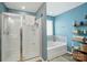 Bathroom view showing glass-doored shower and a soaking tub at 4506 S Potter Rd, Monroe, NC 28112