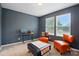 This bedroom with gray walls features two windows and orange furniture at 4506 S Potter Rd, Monroe, NC 28112