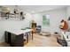Bright craft room with white walls, wood-look floors, and ample storage at 4506 S Potter Rd, Monroe, NC 28112