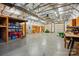 Spacious detached garage or workshop area with ample lighting and dual overhead doors at 4506 S Potter Rd, Monroe, NC 28112