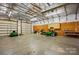 Large detached garage or workshop area with ample lighting and multiple overhead doors at 4506 S Potter Rd, Monroe, NC 28112