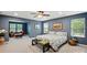 Spacious main bedroom featuring a seating area, soft carpet, and ample natural light through large windows at 4506 S Potter Rd, Monroe, NC 28112