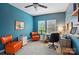 Inviting home office with a calming blue palette, comfortable seating, and a functional workspace at 4506 S Potter Rd, Monroe, NC 28112