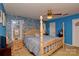 A comfortable bedroom featuring a four-poster bed, ceiling fan, and natural light from the window at 4810 Shea Ct, Monroe, NC 28110