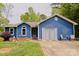 Charming blue single-story home with well-maintained lawn and a cozy front patio area at 4810 Shea Ct, Monroe, NC 28110