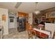 Kitchen featuring stainless steel refrigerator, wooden cabinets, tile floor, and an eat-in dining area at 4810 Shea Ct, Monroe, NC 28110