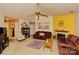 Inviting living room with warm tones, a fireplace, comfortable seating, and a ceiling fan at 4810 Shea Ct, Monroe, NC 28110