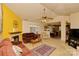 Cozy living room showcasing a fireplace, plush seating, a ceiling fan and an open layout at 4810 Shea Ct, Monroe, NC 28110