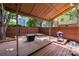 Cozy back deck featuring a grill, comfortable seating, and a shaded canopy for outdoor relaxation at 510 N Alexander St, Charlotte, NC 28202