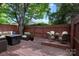 Backyard wooden deck featuring stylish outdoor seating and mature trees at 510 N Alexander St, Charlotte, NC 28202